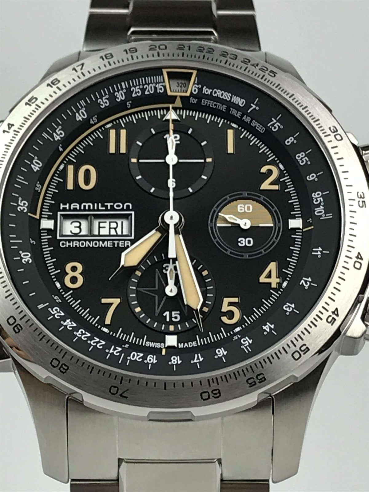 Men's steel chronograph watch with black dial, gold accents, three subdials, automatic movement