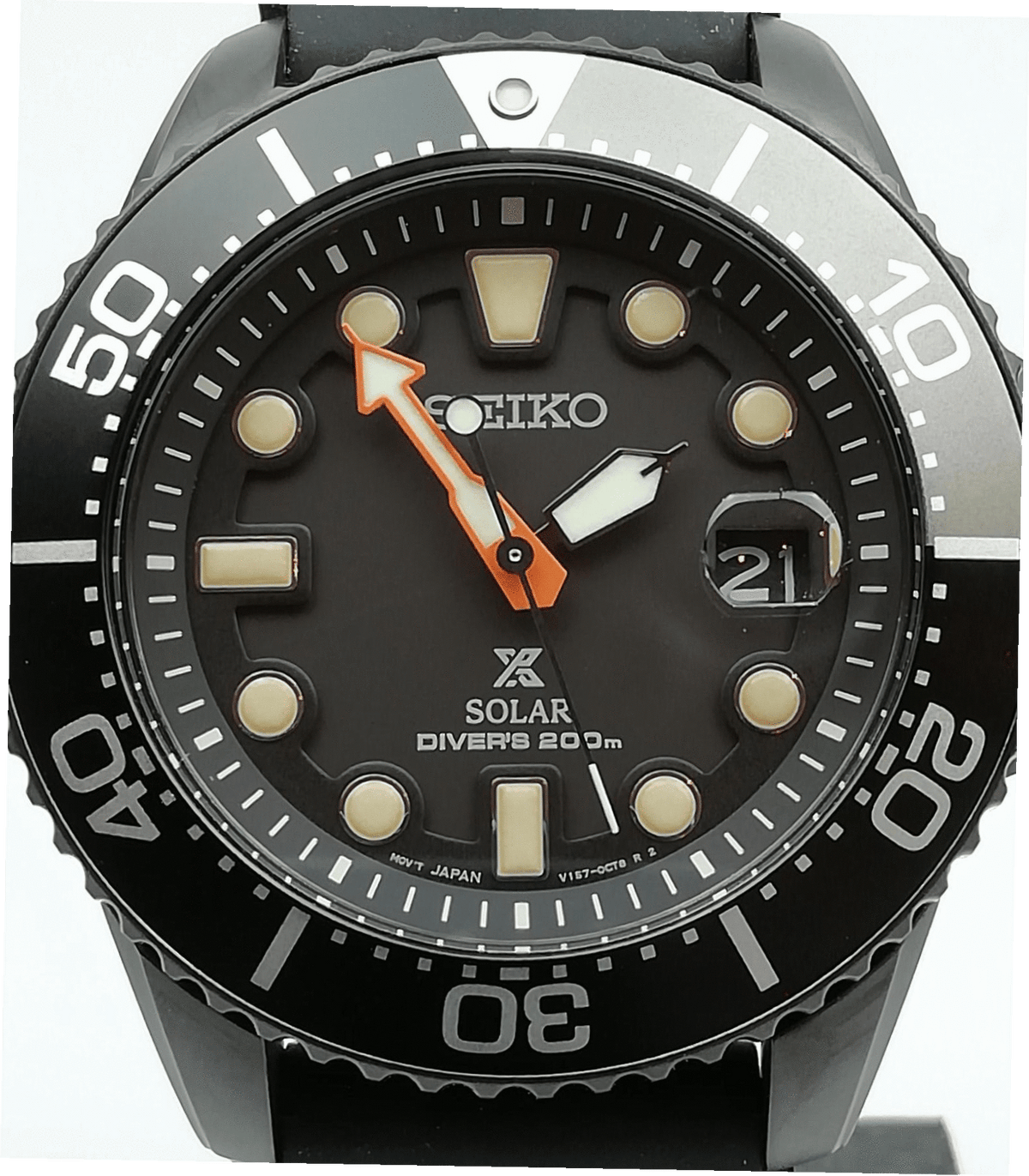 Black dial solar diver's watch with diver bezel markings and orange-accent hands.