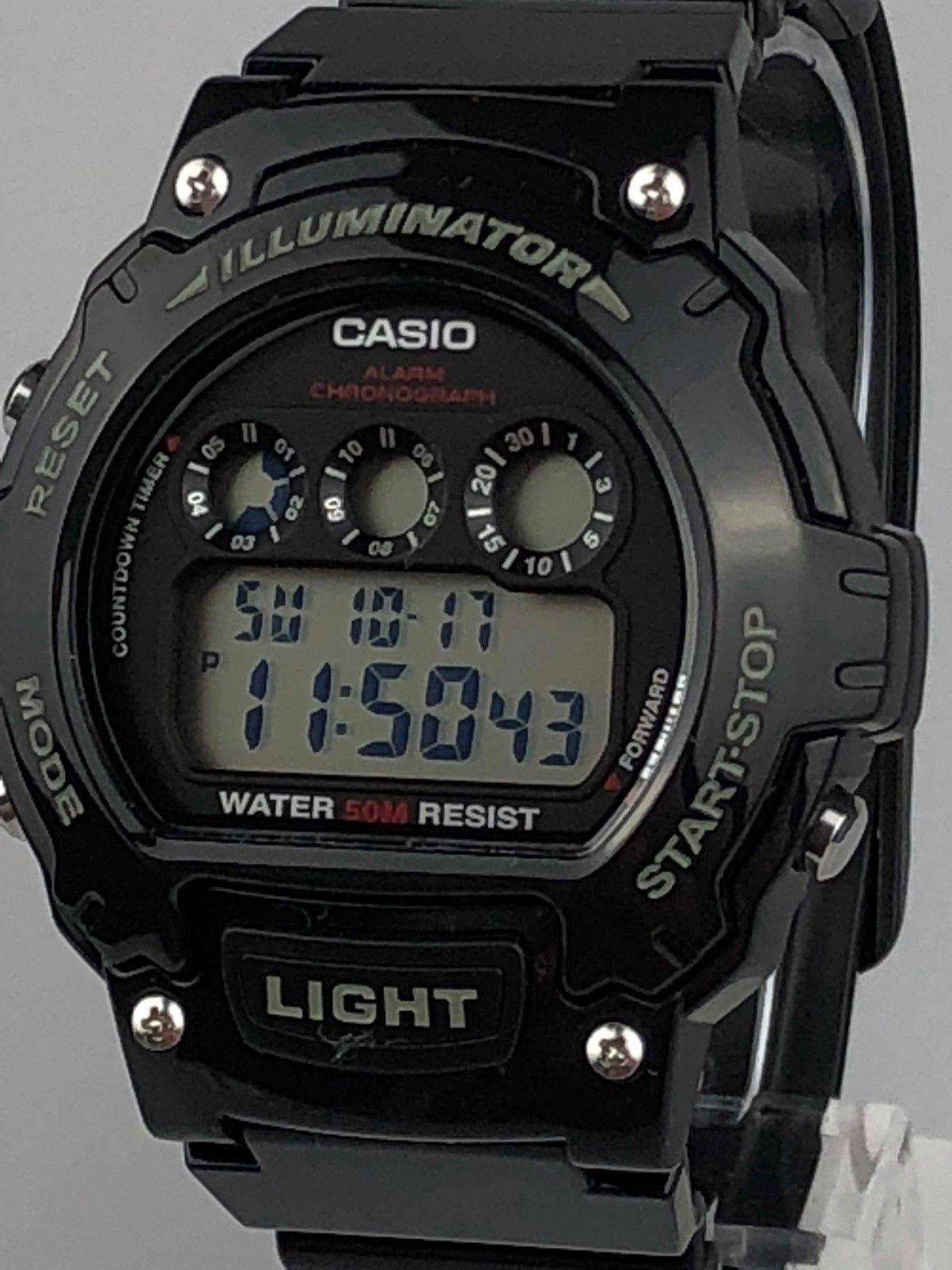 Casio men’s digital sport alarm chronograph watch close-up with black case and blue LCD time