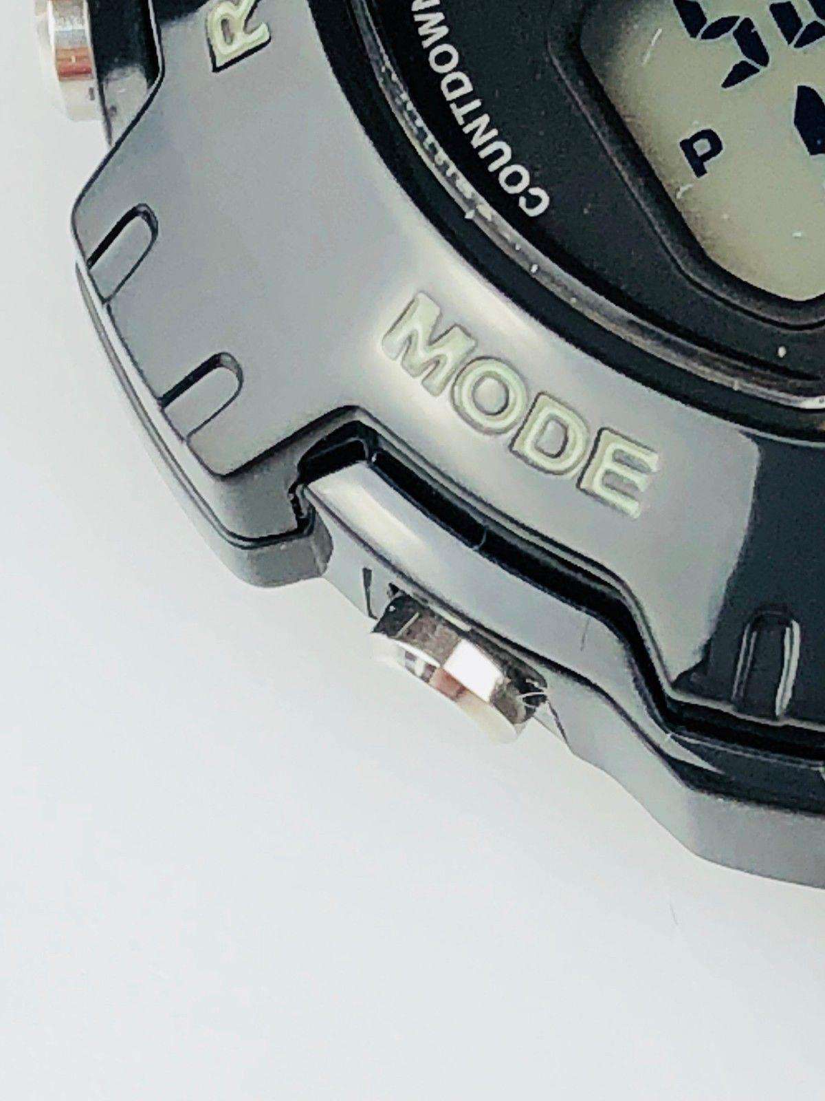 Casio sport watch side button area with “MODE” label on black case
