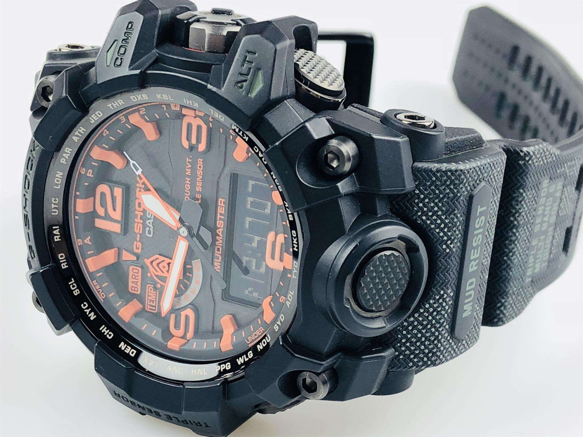 Black Mudmaster watch with perforated strap texture and orange dial markings