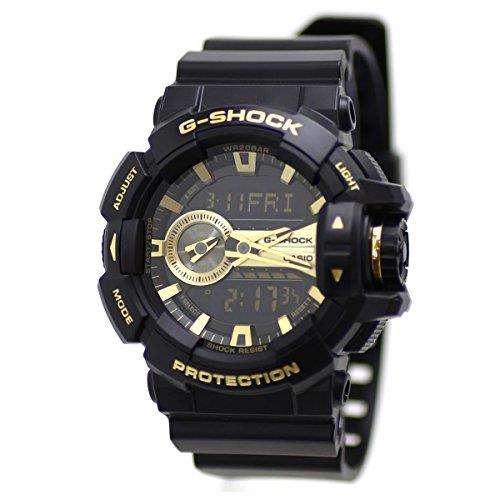 G-Shock black resin wristwatch with round dial and gold-tone accents