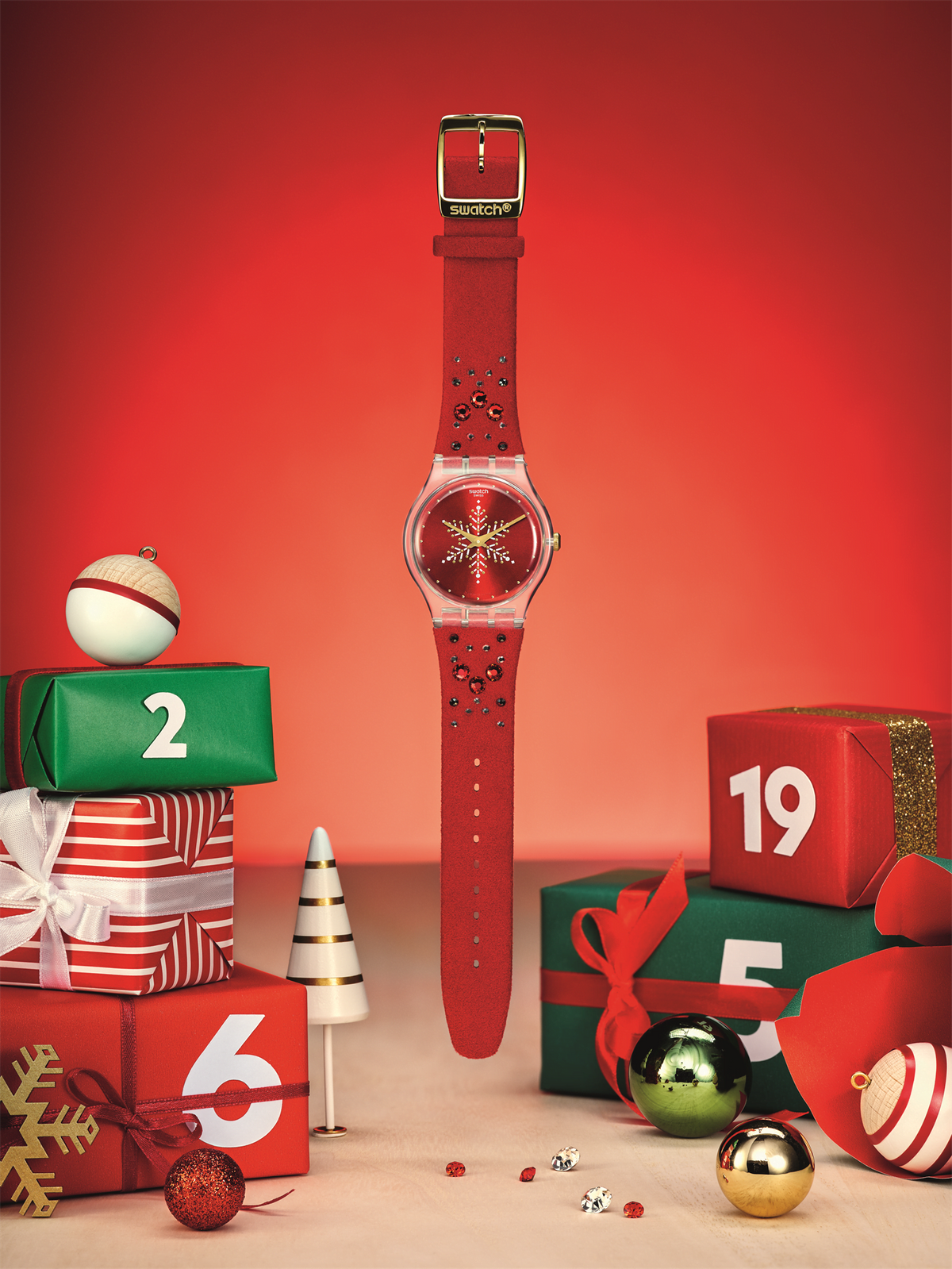 Swatch unisex Christmas wristwatch with red strap and red dial with snowflake design