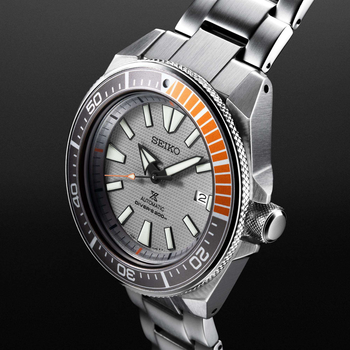 Men's stainless steel dive watch with grey dial, orange bezel, and metal bracelet