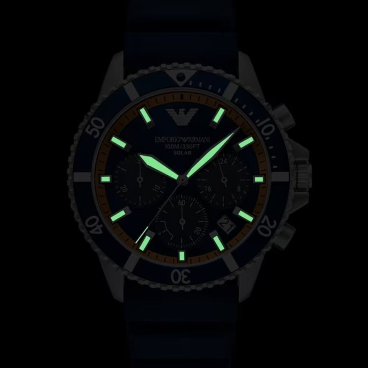 Dark-lume view of solar chronograph watch with green glowing hour markers