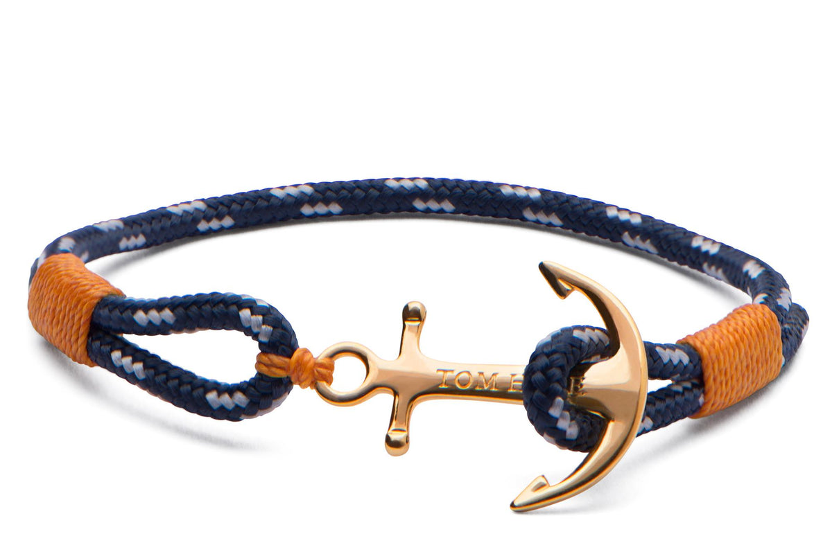 Braided cord bracelet with navy and orange ends, 24K gold-tone anchor and cross charm