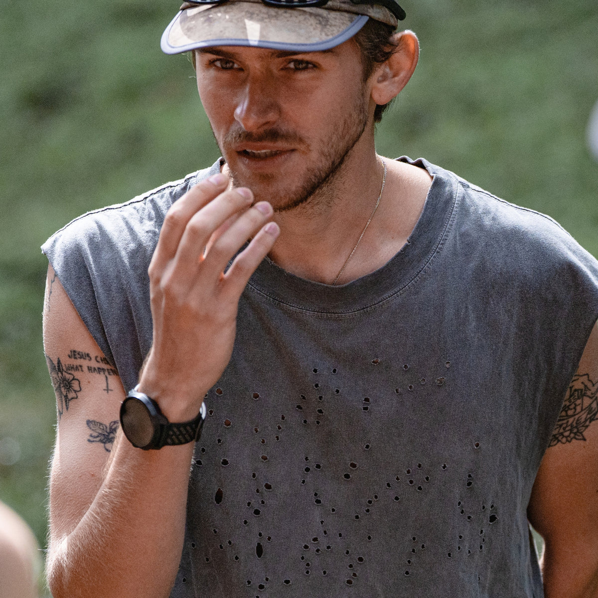 Suunto Race S SS051645000 lifestyle wrist shot displaying black smartwatch worn during outdoor training