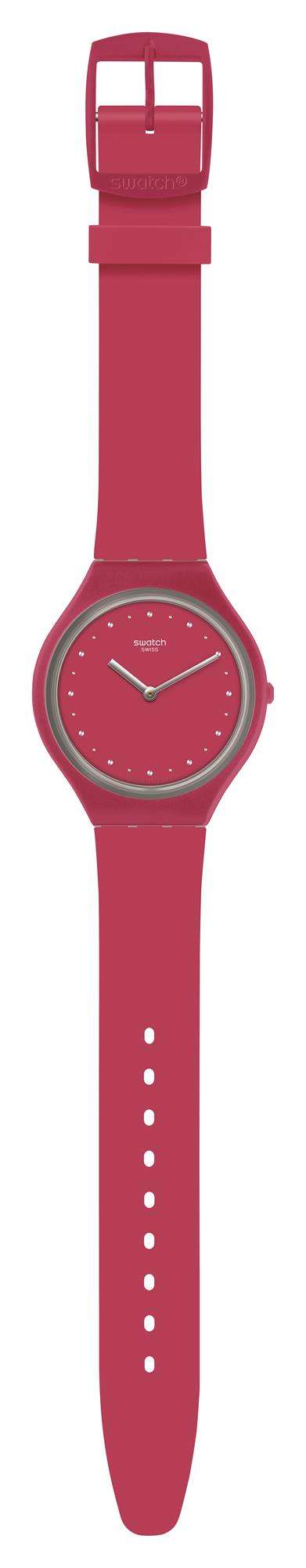 Ladies wristwatch with pink silicone strap and round pink face with dot hour markers