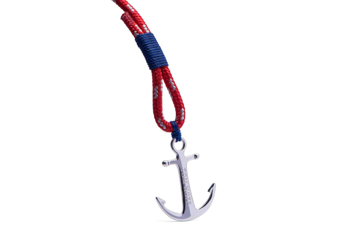 Sterling silver anchor charm on red braided cord with blue accents