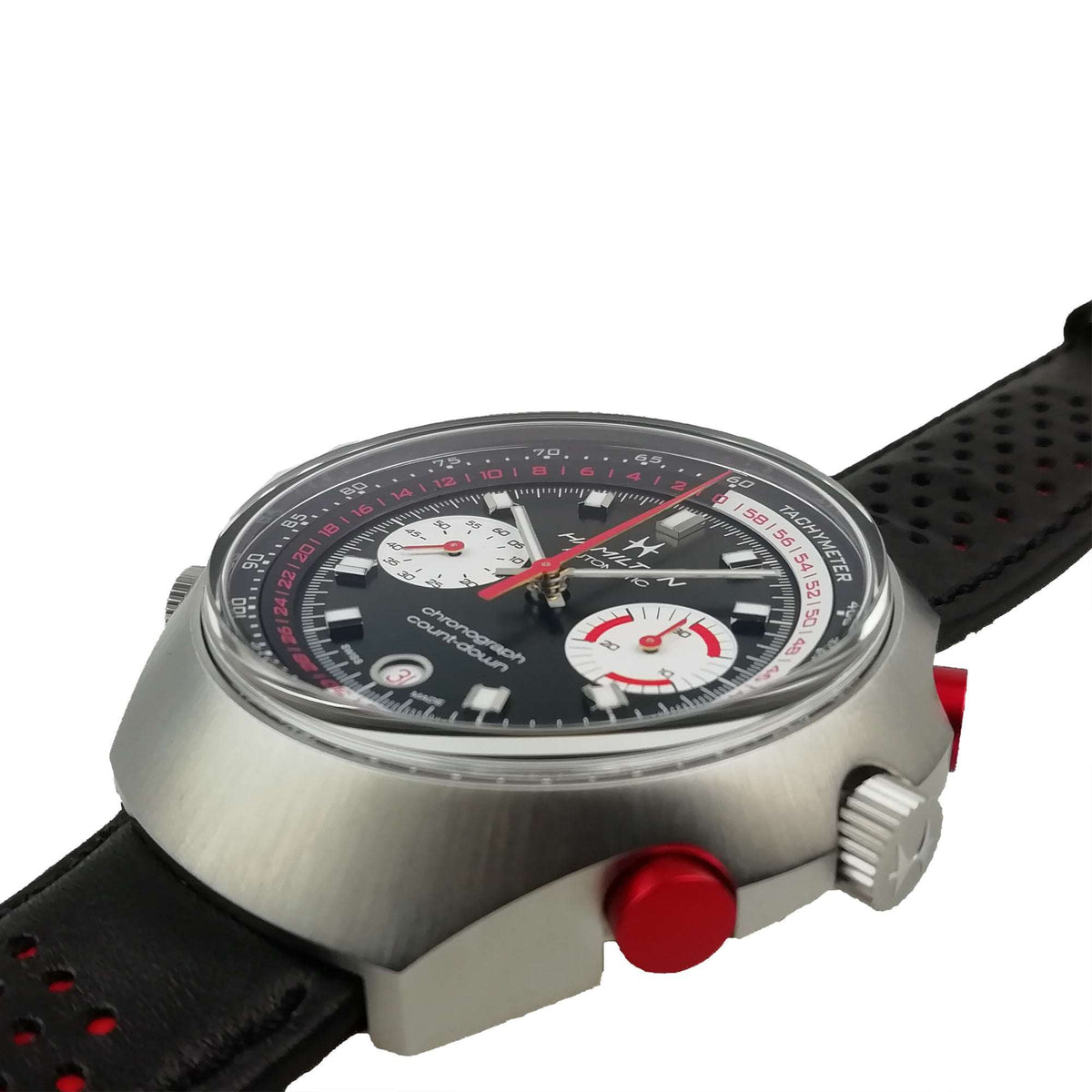 Men’s automatic chronograph watch top view with black dial, red seconds hand, leather strap