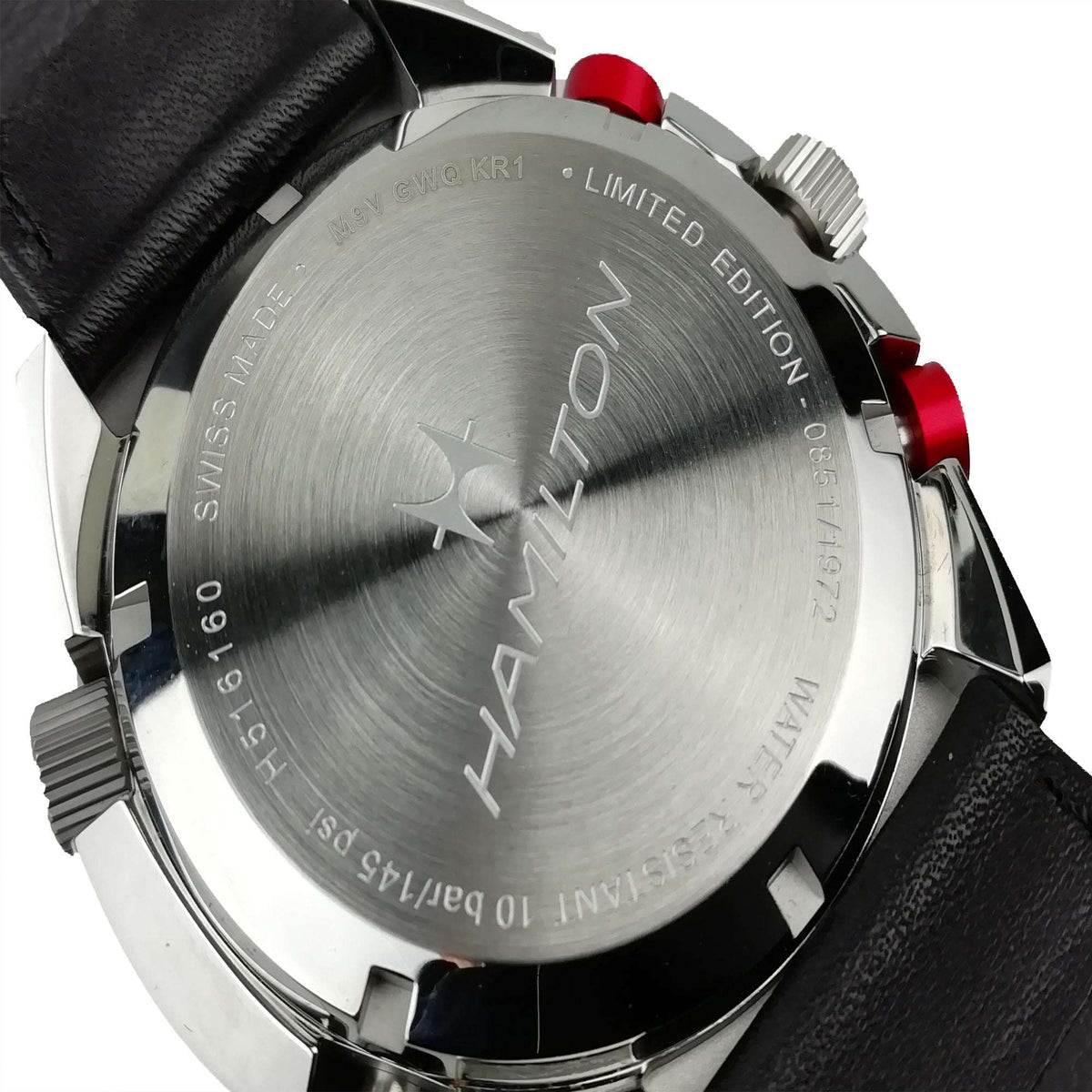 Limited edition stainless watch with brushed silver dial, red crown accents, black leather strap