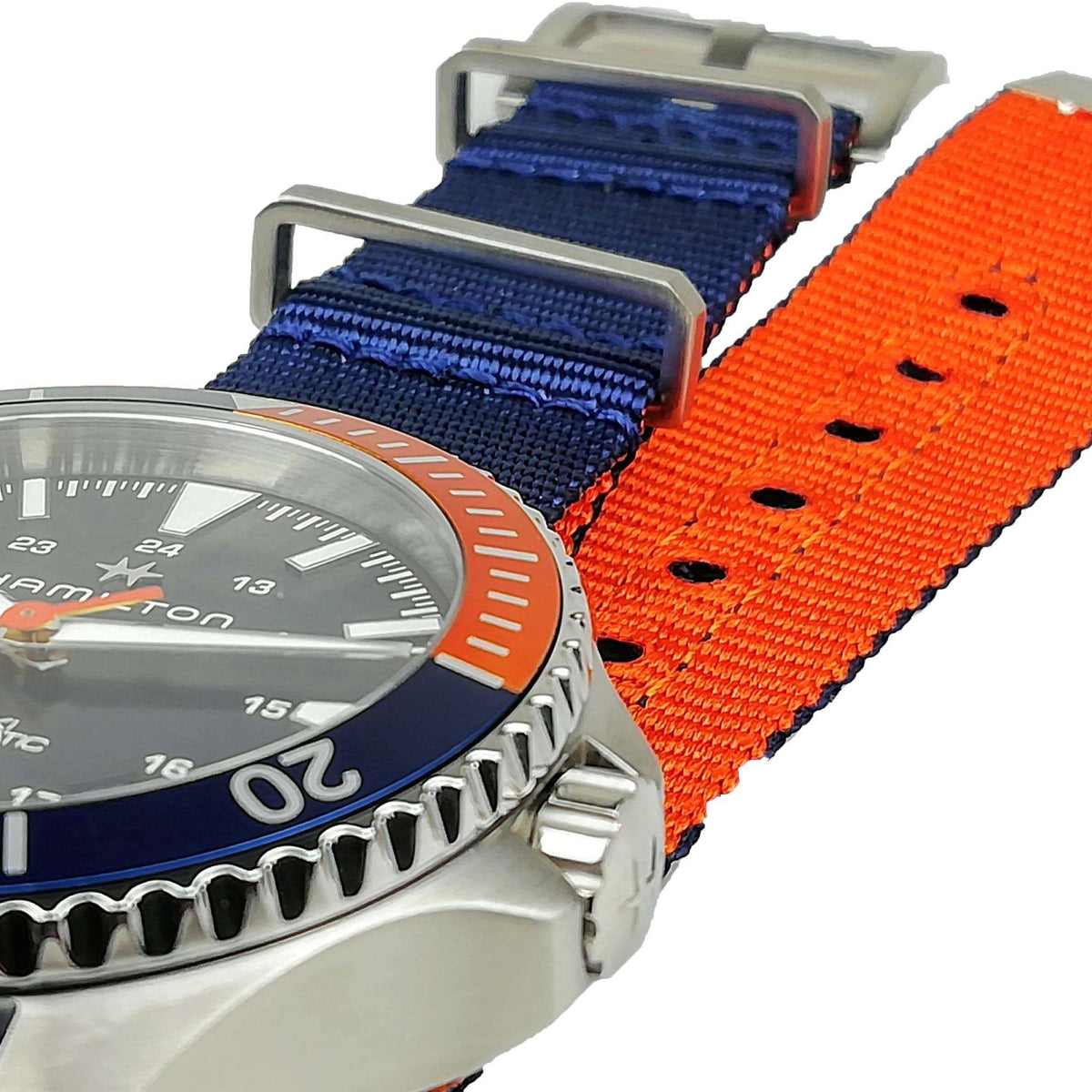 Blue NATO strap with orange accent stripe on a stainless steel diver watch