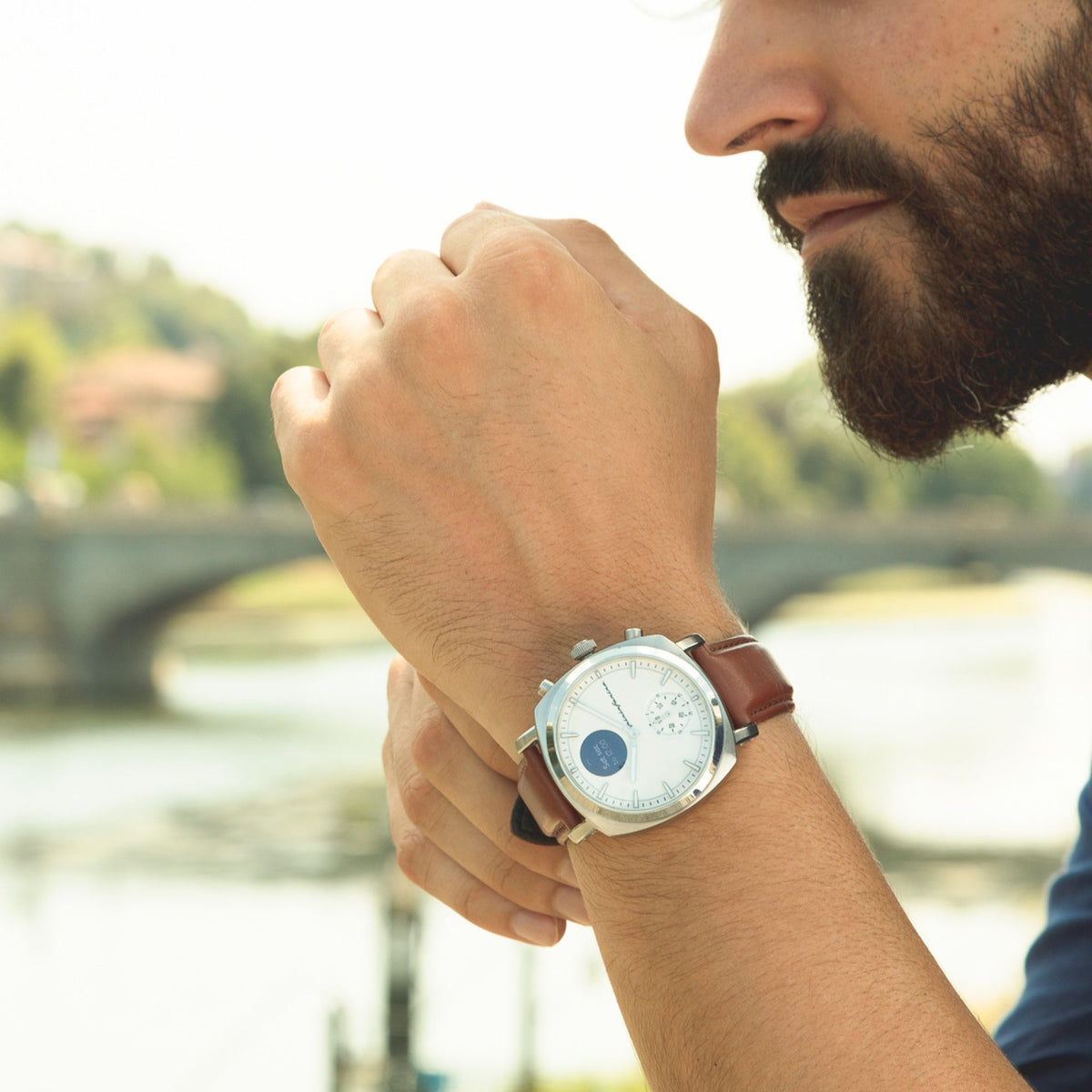 Pininfarina Senso Hybrid PMH01A-01 white dial watch showing digital screen complication close-up on wrist