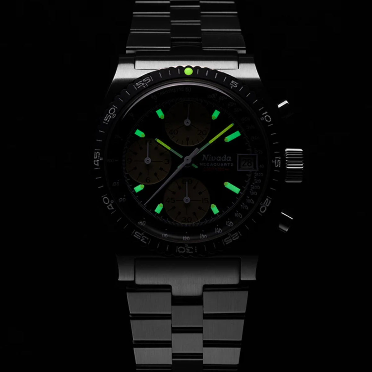 Nivada Grenchen Autochron 77001Q01 dark view with green luminous watch dial