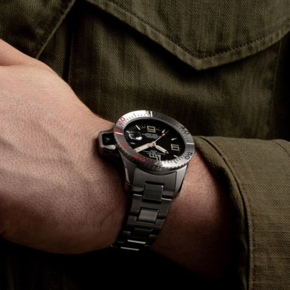 BALL Engineer Hydrocarbon EOD DM3200A-S1C-BK wrist shot displaying mens automatic watch with military uniform sleeve