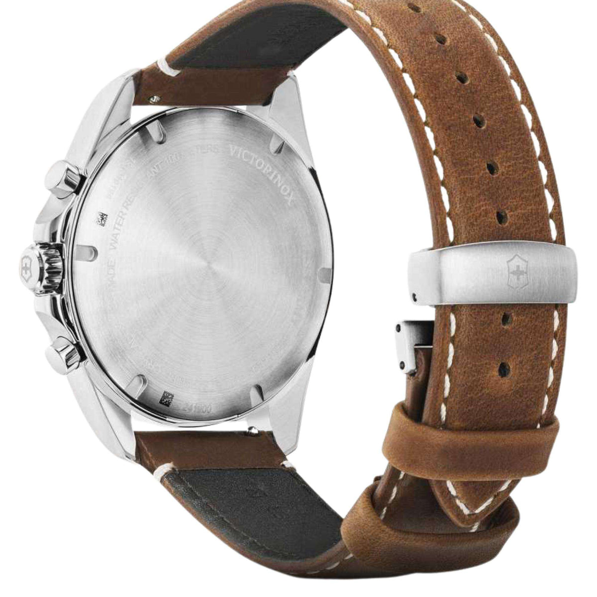 Chronograph watch caseback with brown leather strap, angled close-up