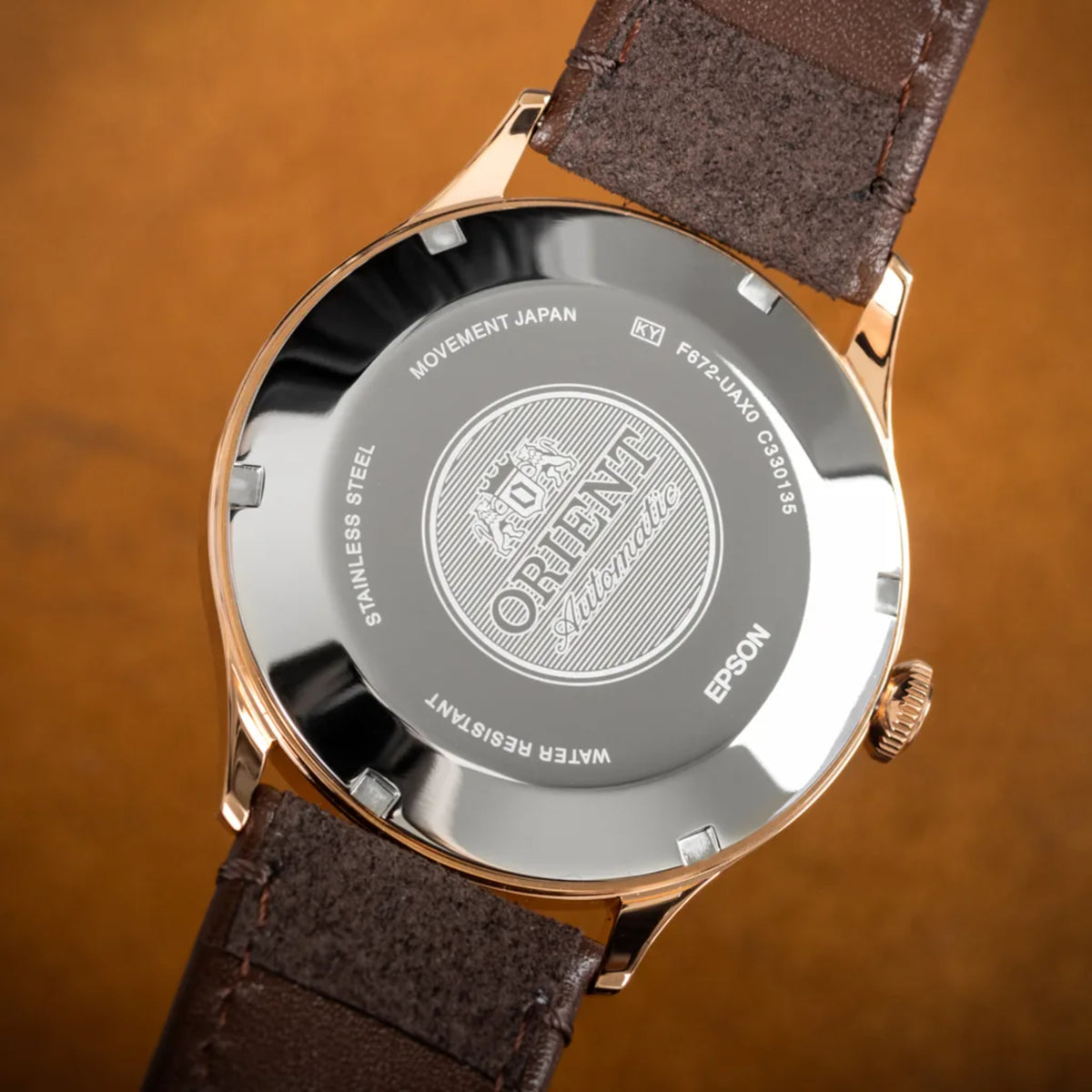 Orient Bambino RA-AC0P04Y30B close-up back case displaying automatic movement details and stainless steel back