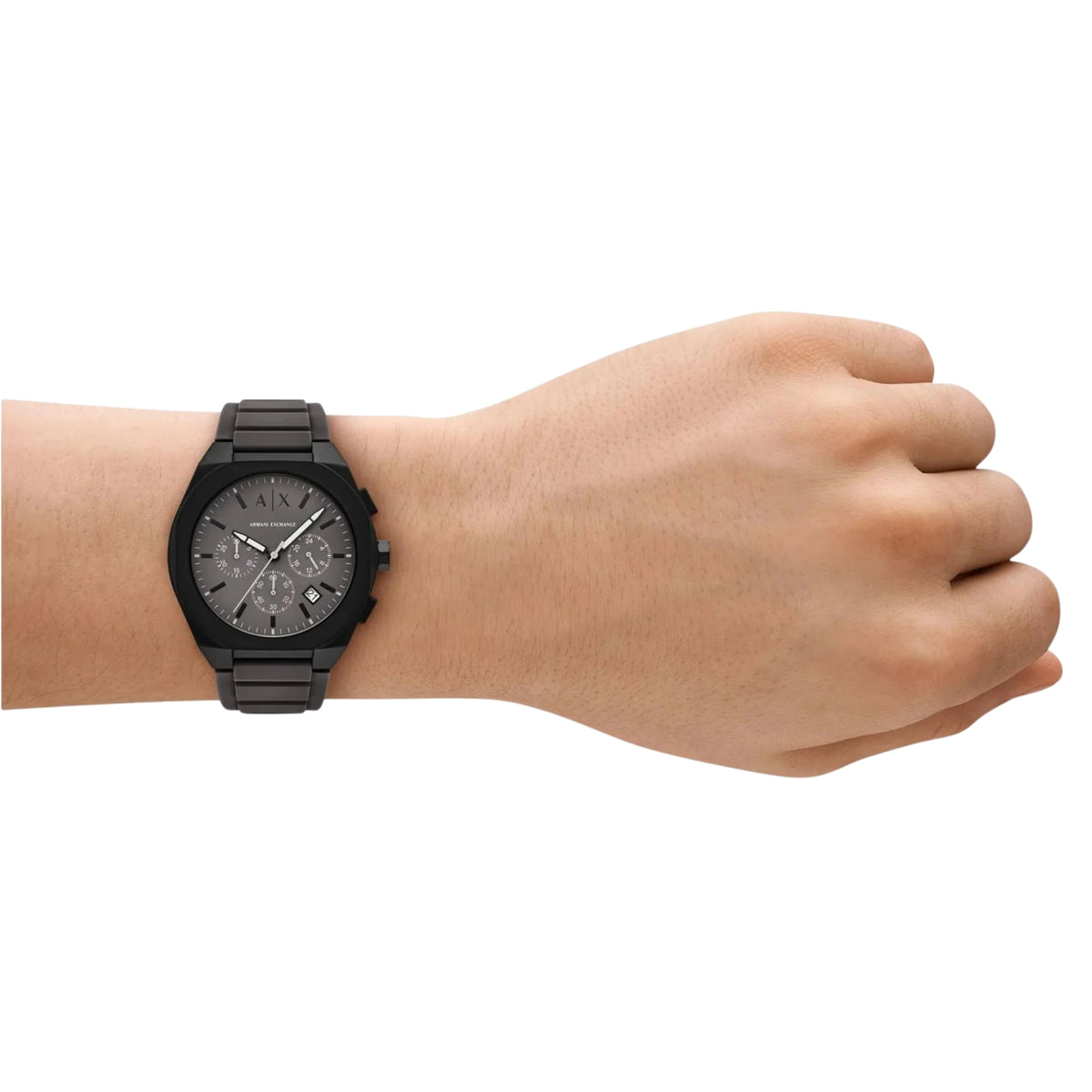 Men's chronograph watch worn on wrist with dark dial and dark segmented strap