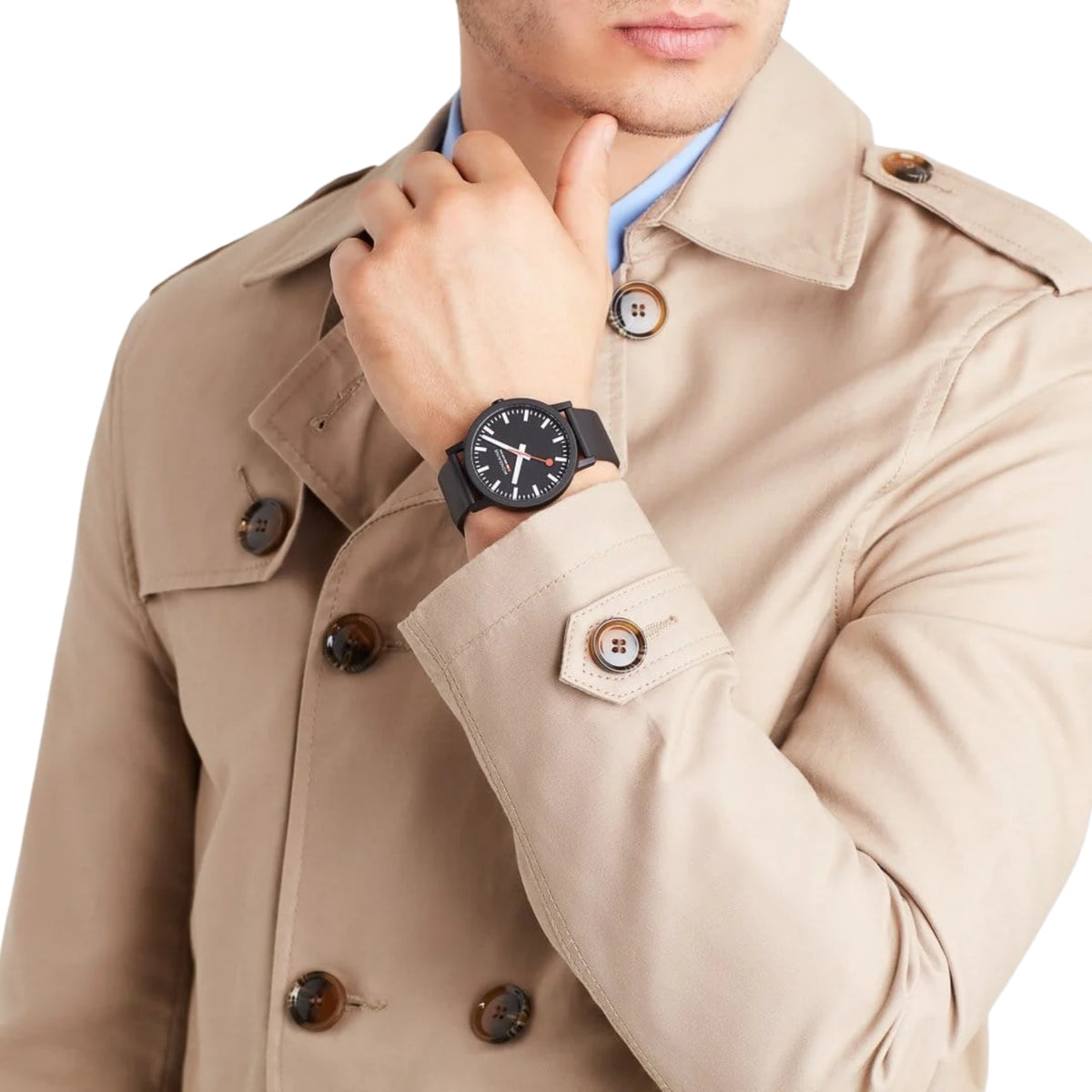 Mondaine Essence MS1.41120.RB 40mm quartz wrist watch worn on a male wrist, paired with a beige trench coat