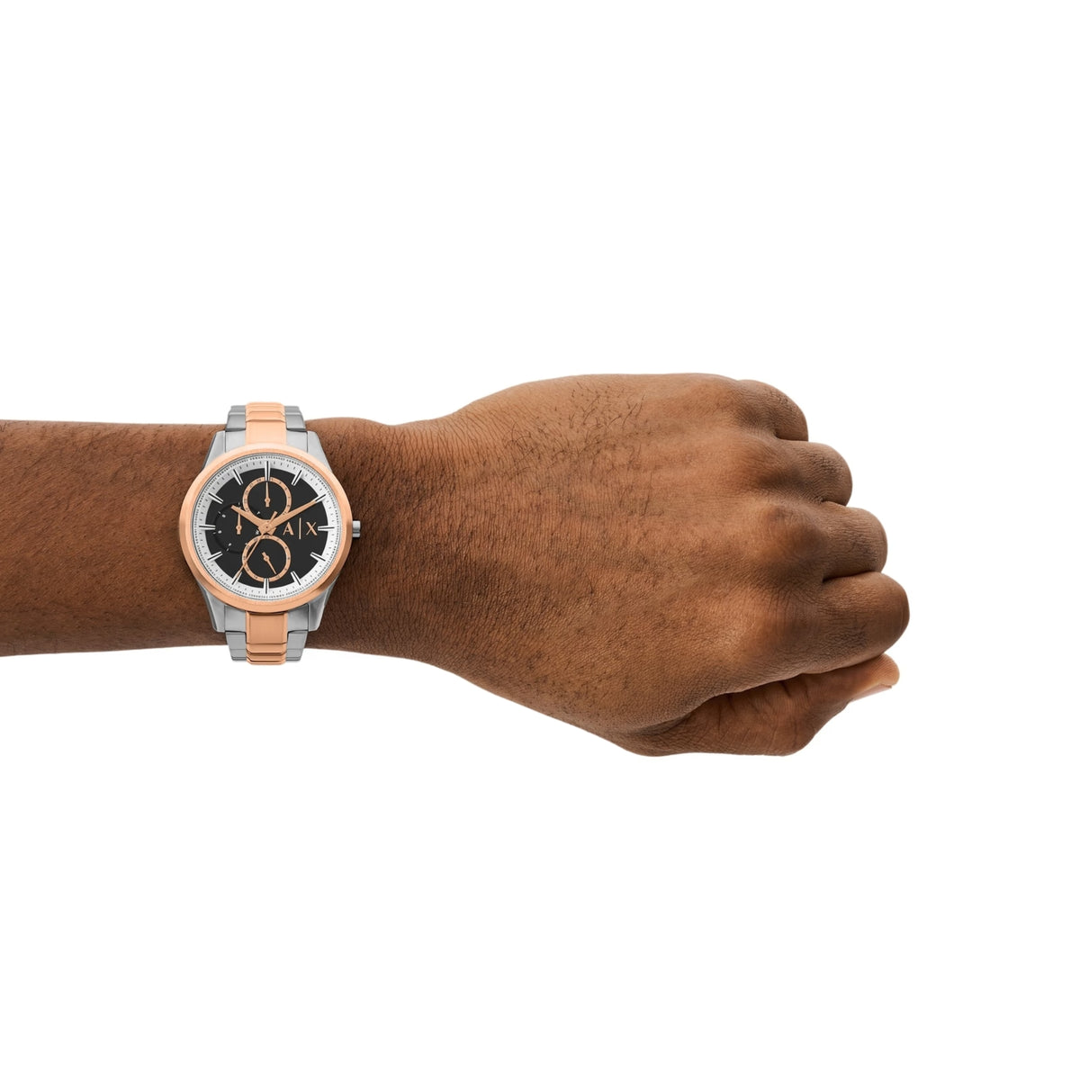 Chronograph watch on wrist with black dial and tan center bracelet links