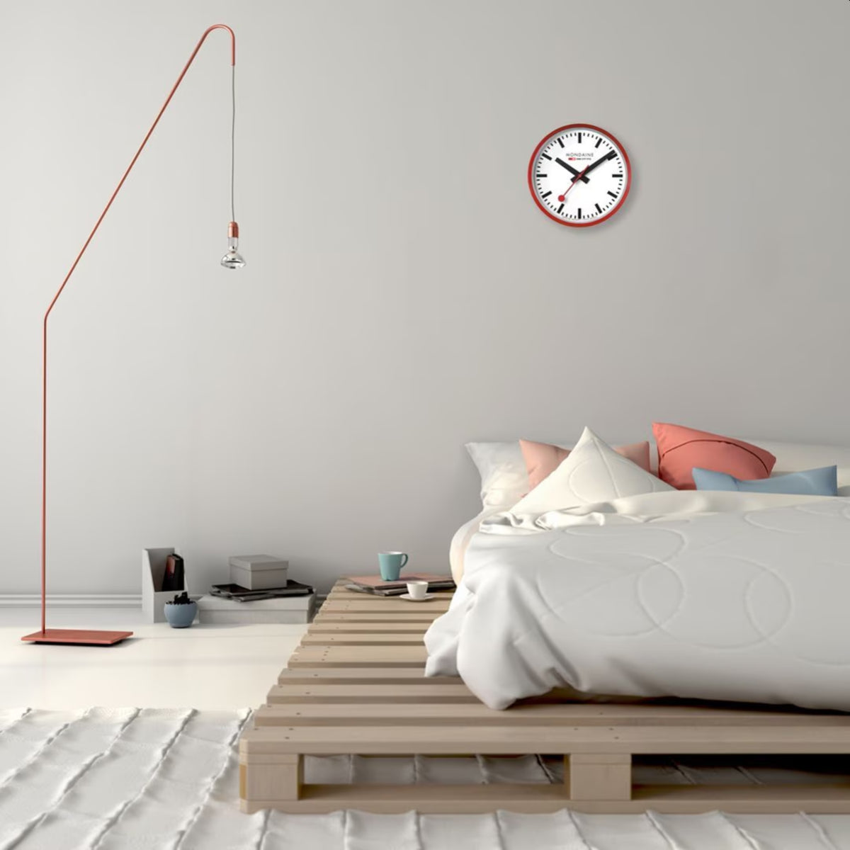 Mondaine wall clock with white dial and red aluminum case, quartz movement