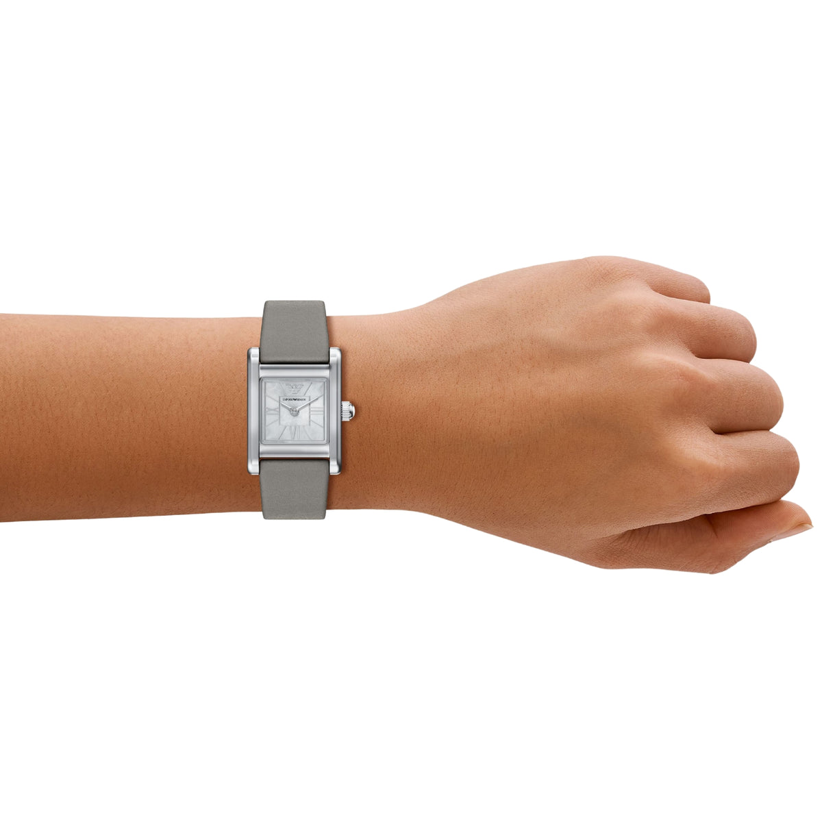Ladies quartz watch worn on wrist with gray leather strap and silver mother-of-pearl dial