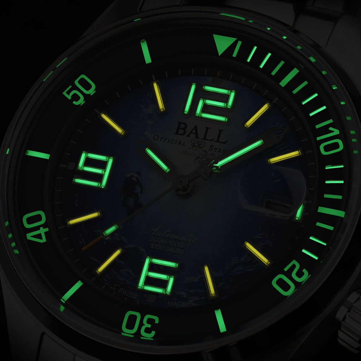 Close-up of BALL DM2280A-S8-BE blue dial diver showing hands illumination in low light