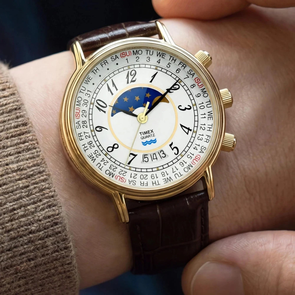 Timex Reissue 1990 Moon Phase TW2Y99000 wrist view showing white dial quartz watch styled on a person wearing a leather strap