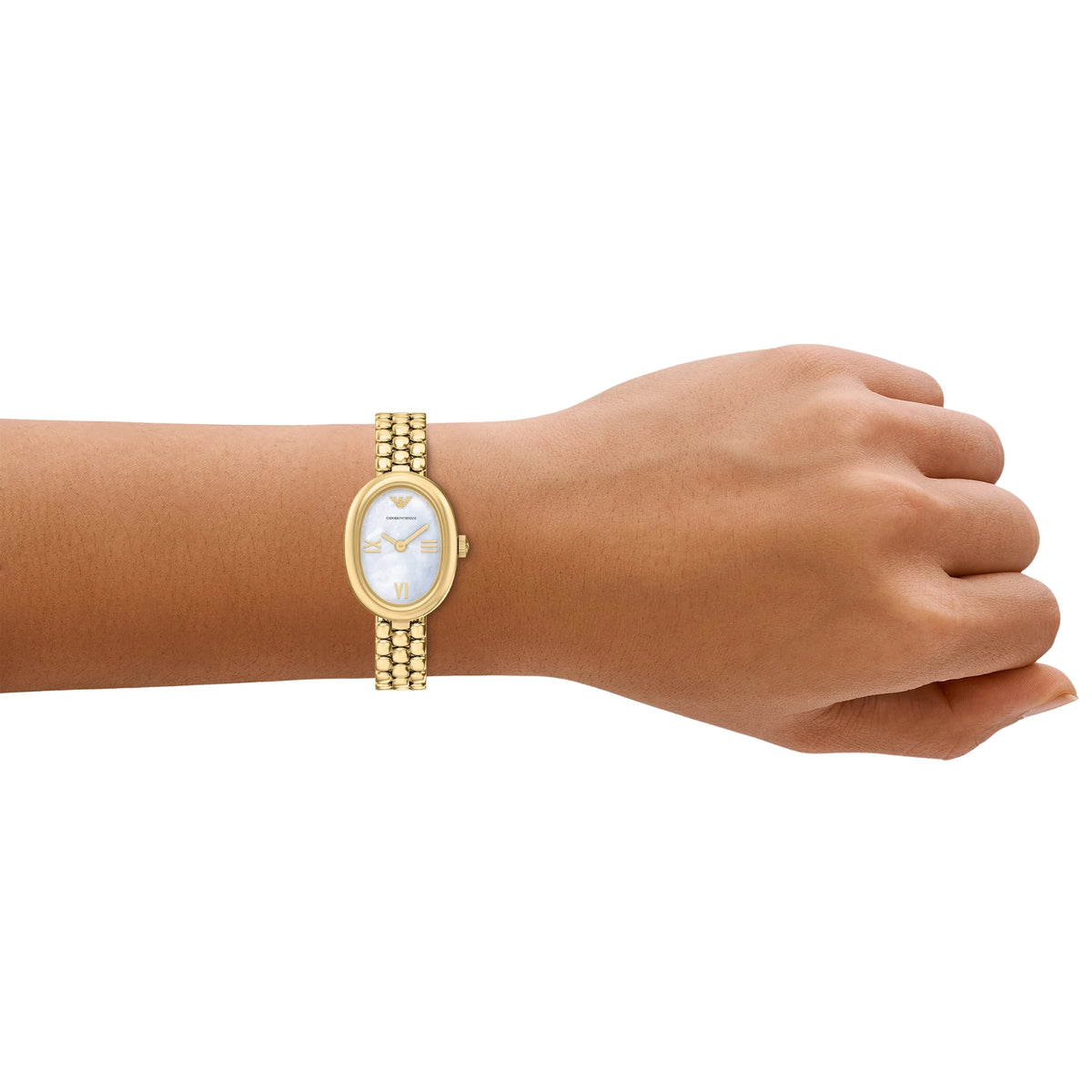 On-wrist shot of the Emporio Armani Sinfonia AR11721 timepiece displaying the white oval dial and gold-tone bracelet on a wrist