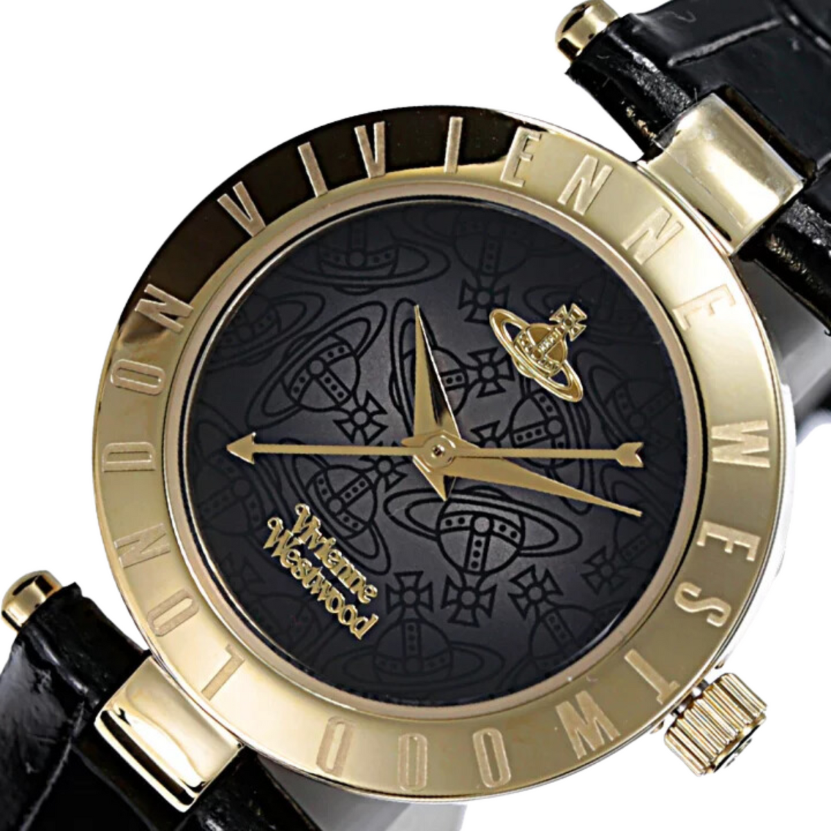 Gold-tone bezel quartz watch with black dial pattern, hands, and leather strap detail