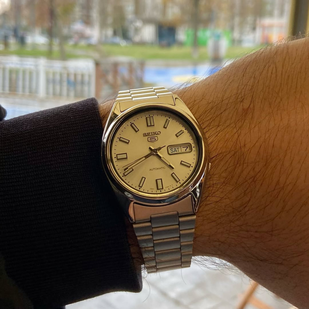 Seiko 5 Automatic SNXS73K1 on-wrist view showcasing the fit of the stainless steel case and multi-link bracelet