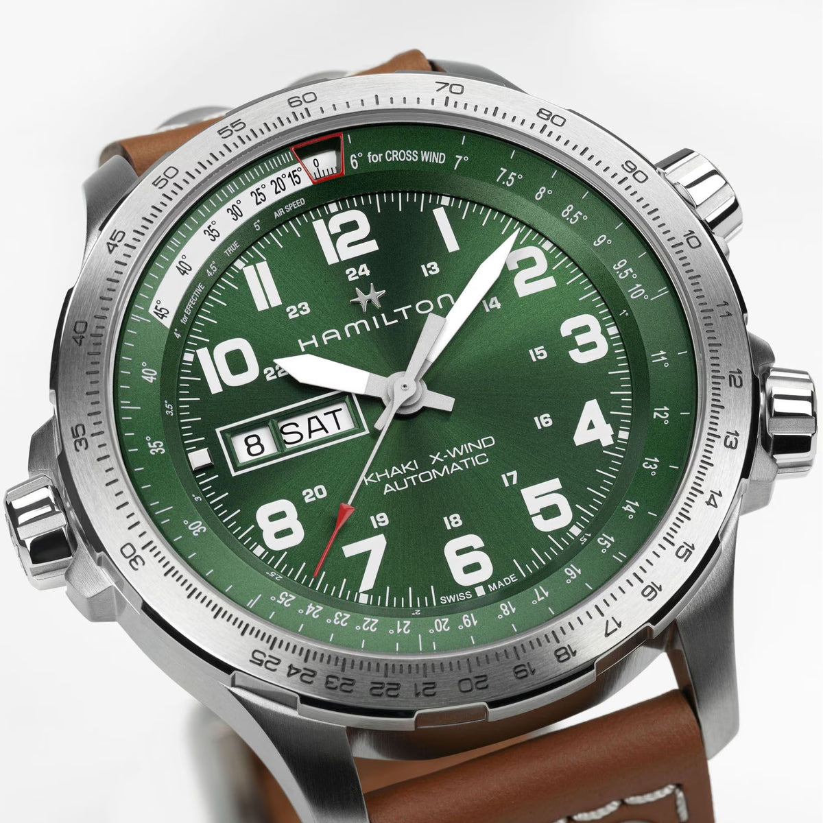 Hamilton Khaki Aviation H77735560 45mm mens watch head detail focusing on green dial with slide rule bezel and steel crowns