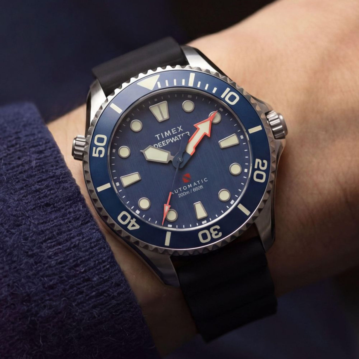 Timex Deepwater TW3A01700 wrist view showing blue dial automatic watch styled on a person wearing a black strap
