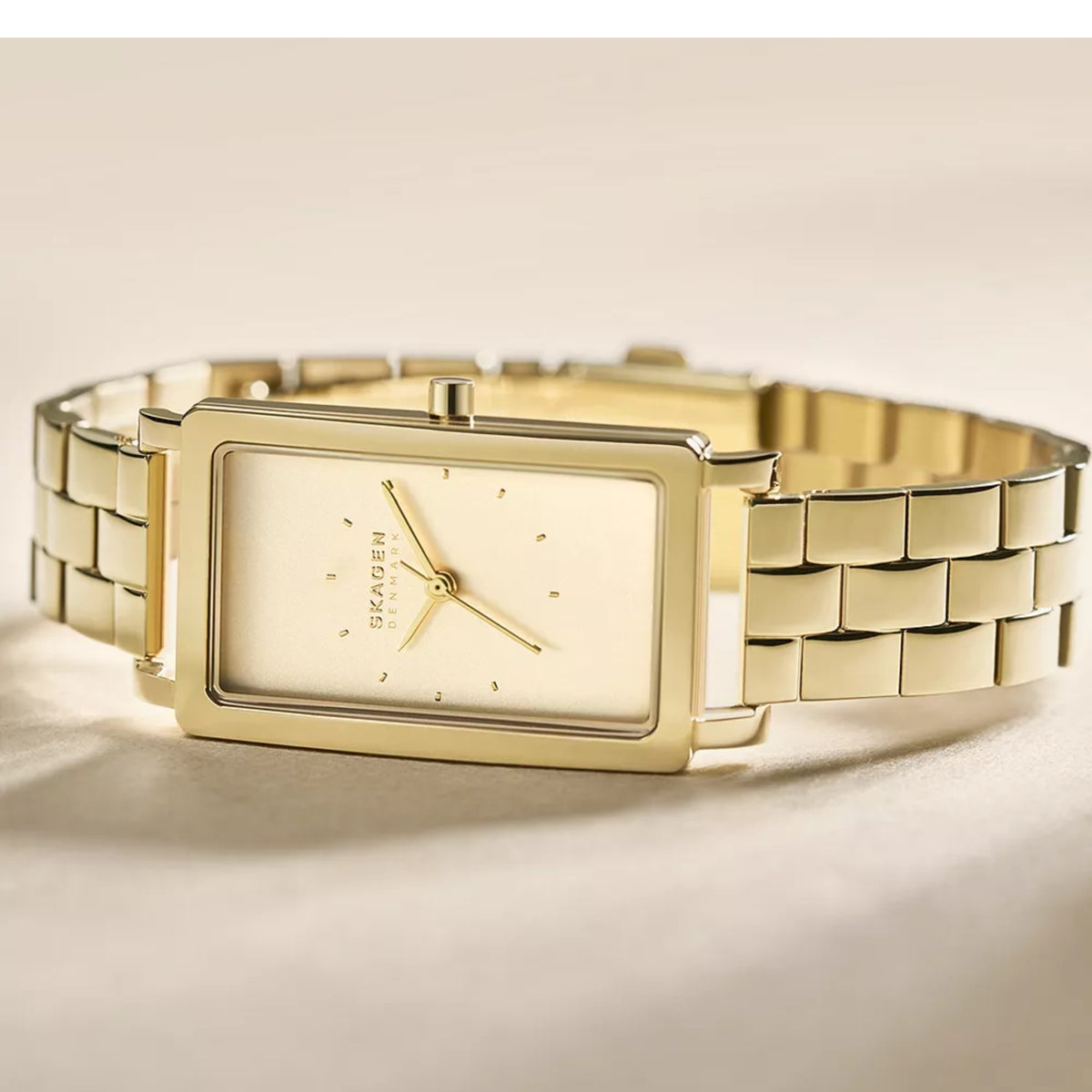 Gold-tone rectangular ladies quartz watch with cream dial and link bracelet