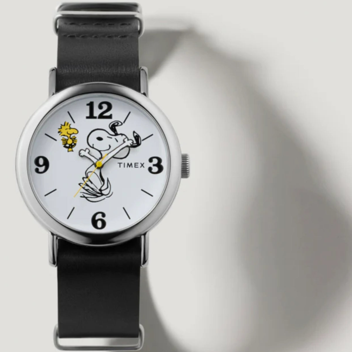 Timex leather quartz watch with white dial and Peanuts character graphic, black strap