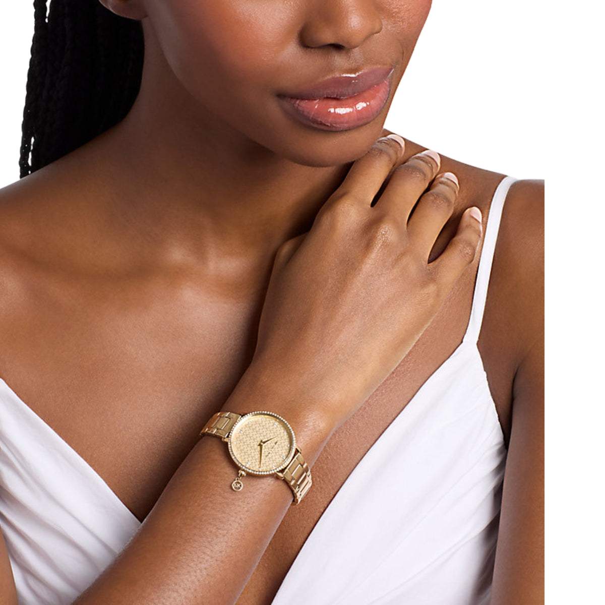 Michael Kors Pyper MK7572 ladies quartz watch worn on a wrist showing the patterned gold dial and matching gold-tone steel bracelet