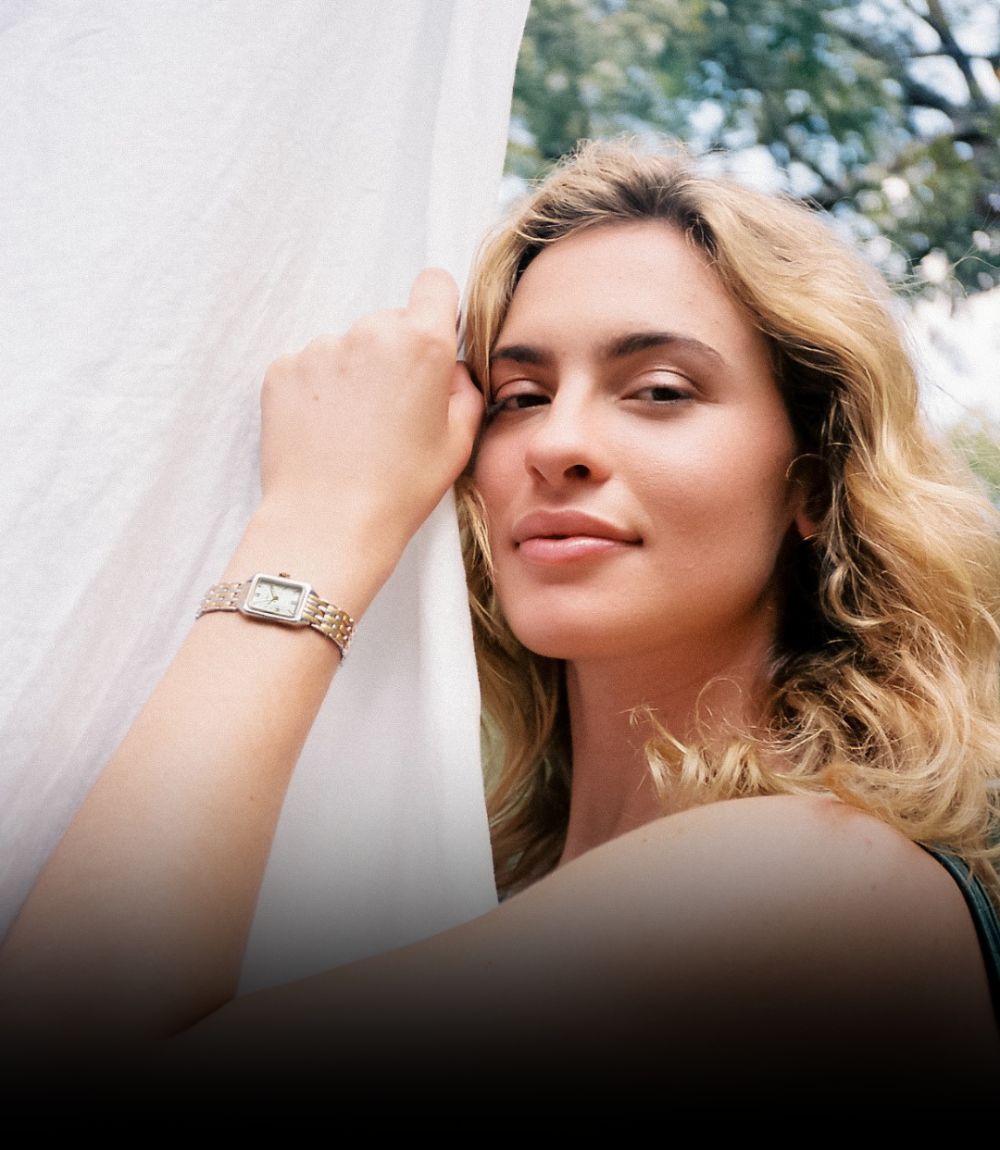Fossil womens rectangular watch featuring silver-tone link bracelet, white dial, and gold-tone bezel details