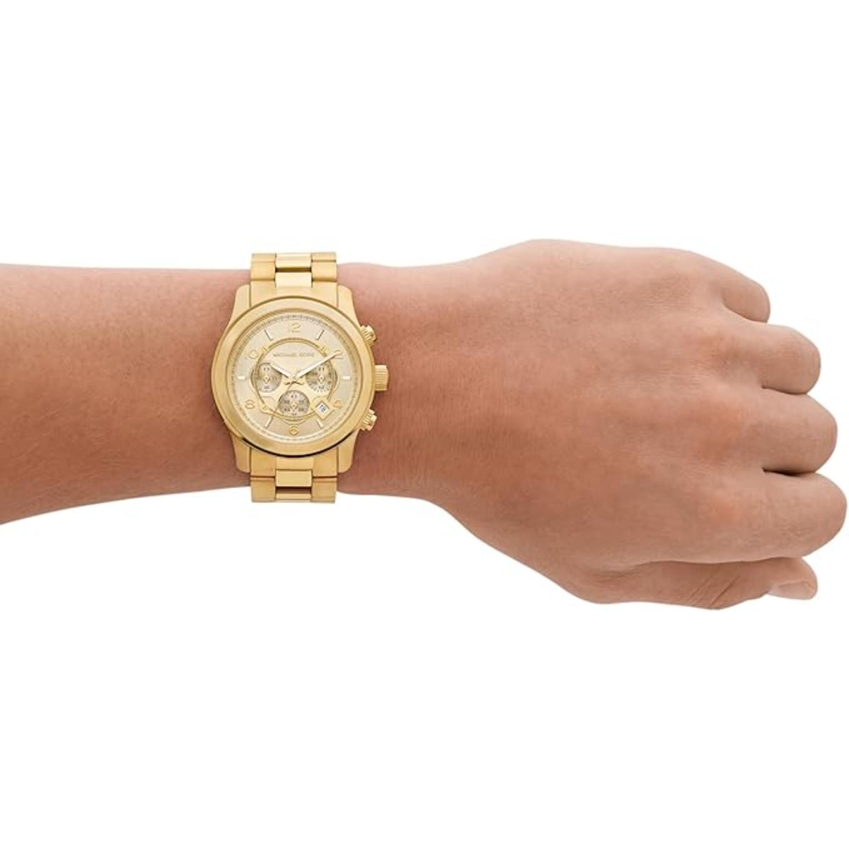 Gold steel chronograph watch on wrist with round dial and metal link band.
