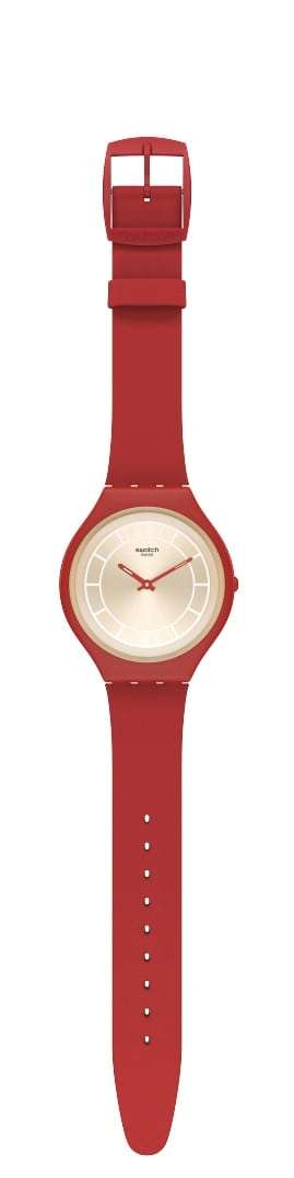 Red leather strap watch shown from side with buckle and round beige dial
