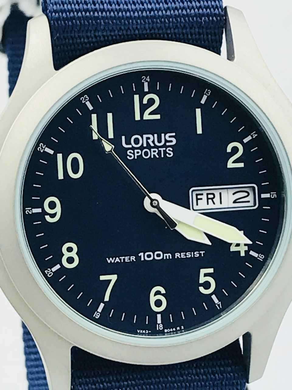 Lorus men's sports watch close-up, blue fabric strap, black dial with FRI 2 date