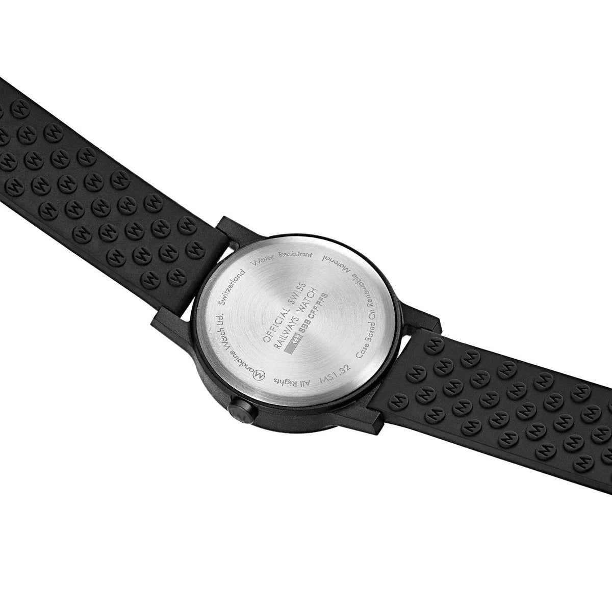 Ladies watch with black rubber patterned strap and round case back