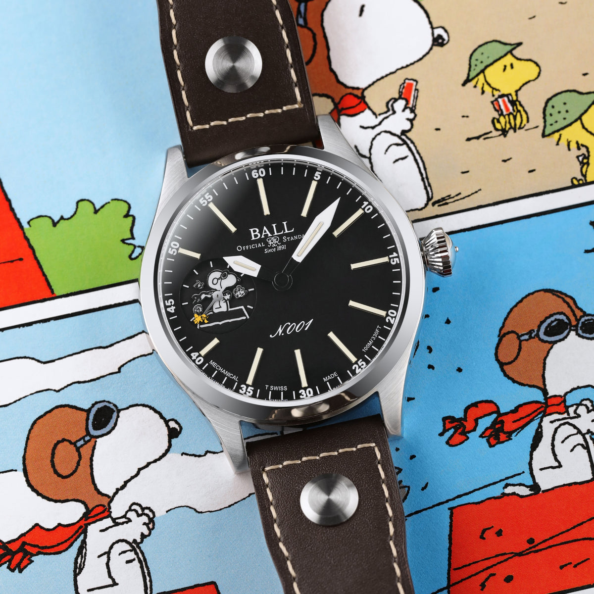 Men's wristwatch close-up: black dial with Snoopy theme and brown leather strap.