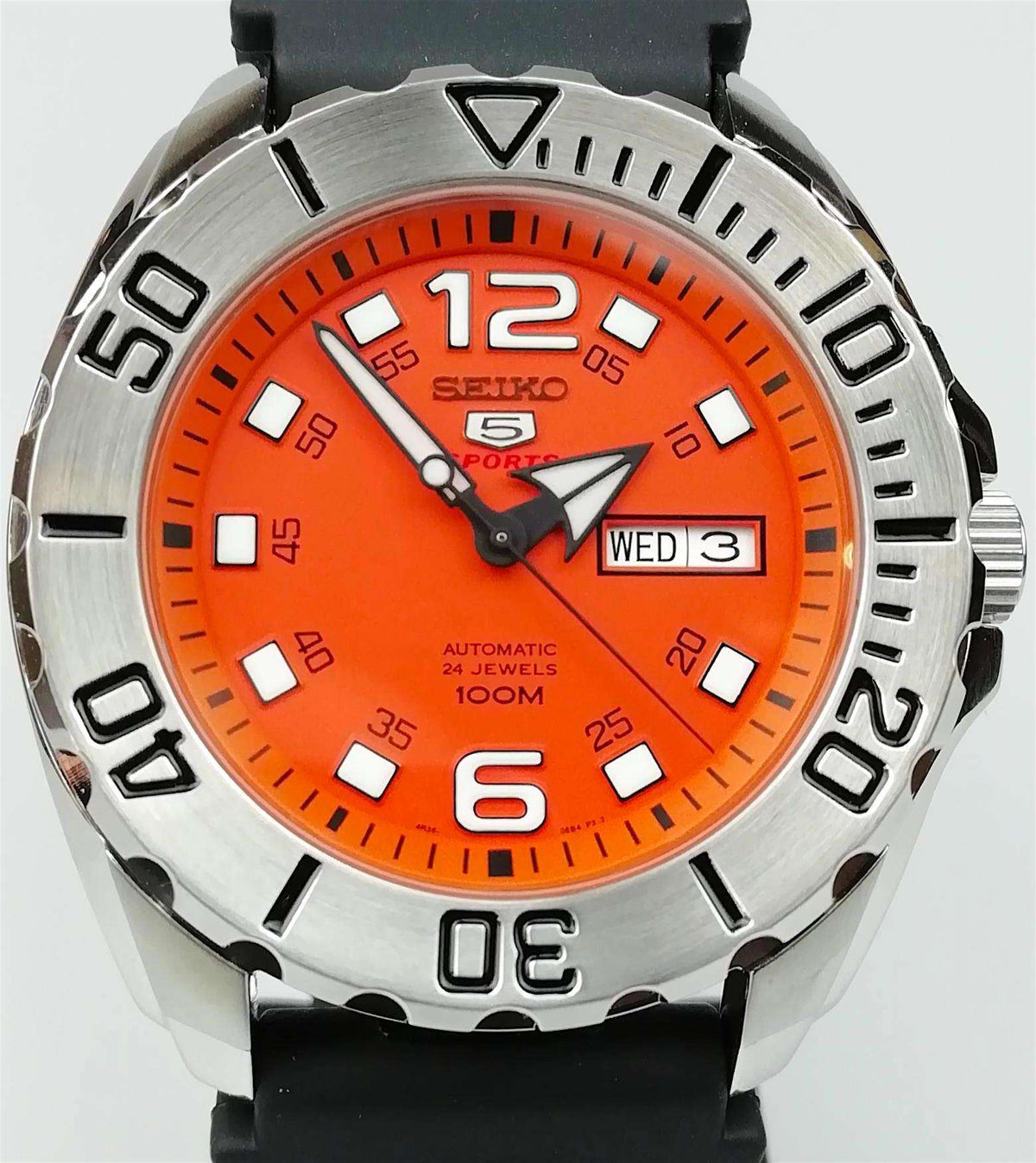 Men's automatic watch with orange dial, silver bezel, black strap, date window