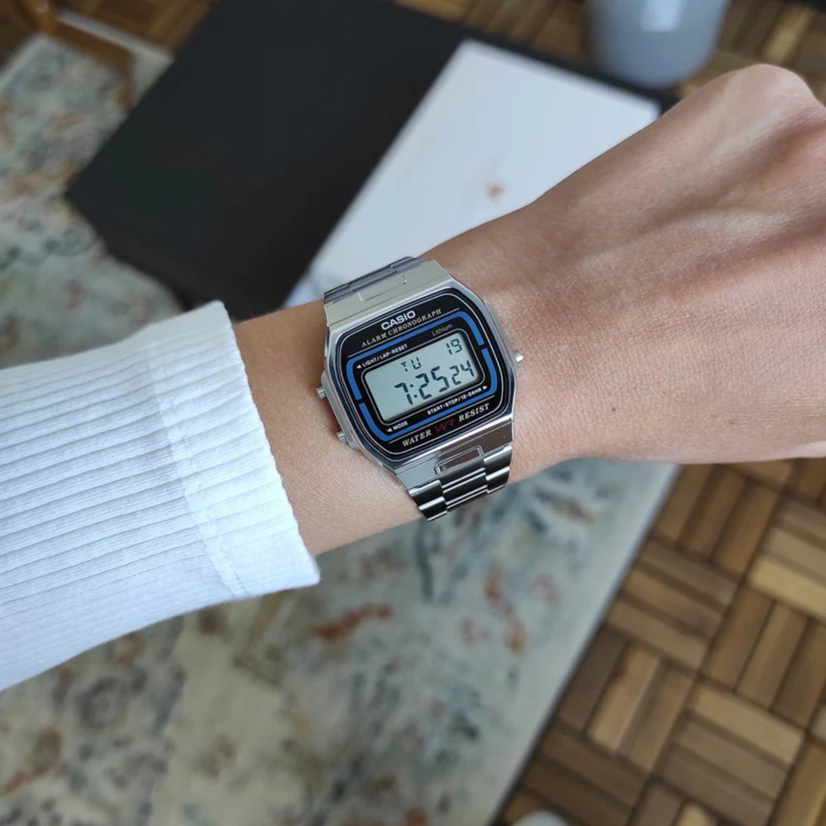 Casio A164WA-1VES steel digital quartz watch close-up on wrist with LCD time readout
