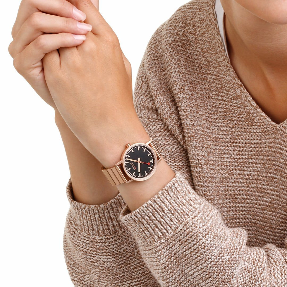 Mondaine Classic 36mm quartz watch on wrist, black dial with rose gold-tone hour markers
