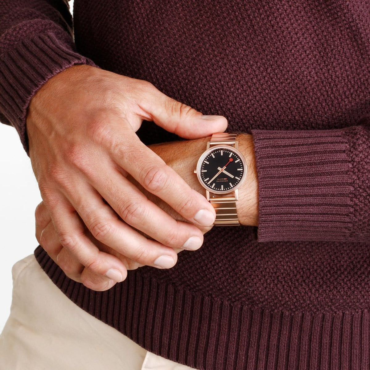 Mondaine Classic 36mm quartz watch on wrist, black dial with rose gold hands and markers