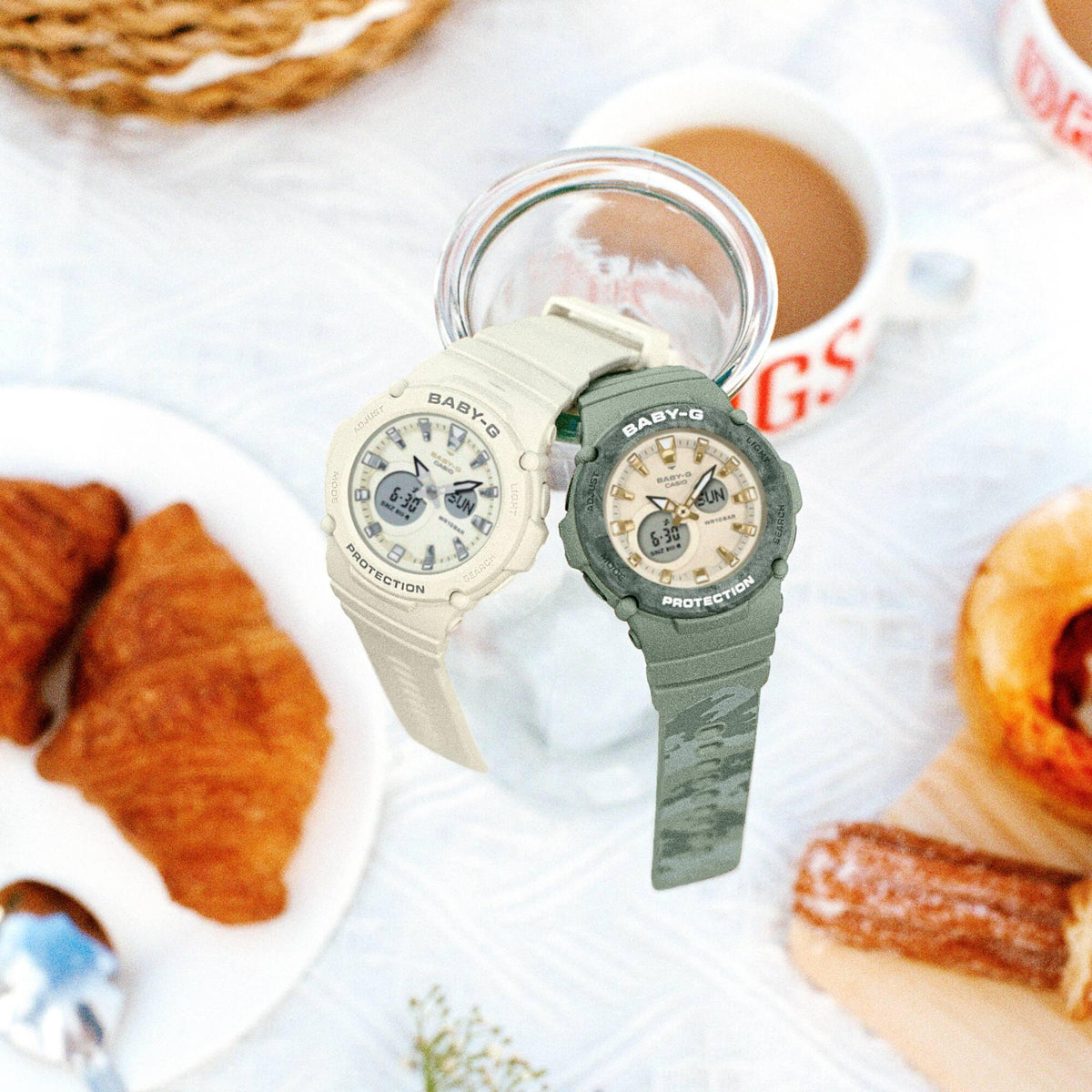 Casio Baby-G watches: one white-strap and one green-strap with cream dials