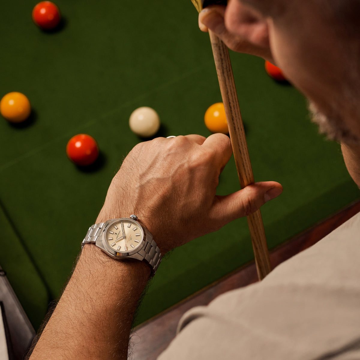 Men's automatic watch on wrist, champagne dial and steel links