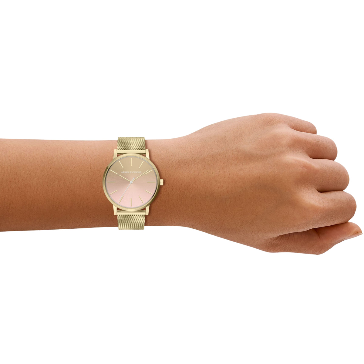 Gold-tone stainless steel mesh watch worn on wrist with pink dial