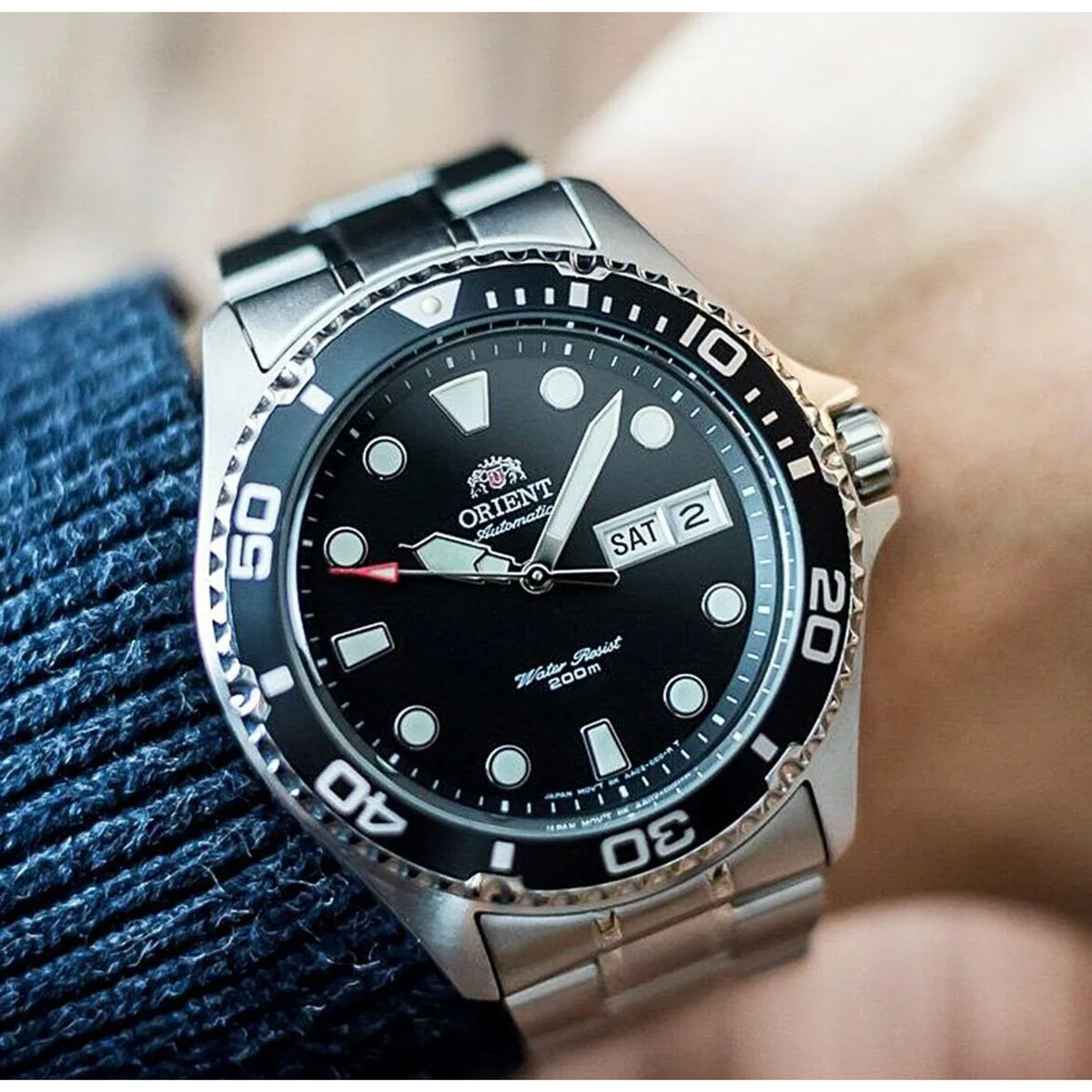 Men’s automatic dive watch on blue denim with black dial and date window “SAT 2”